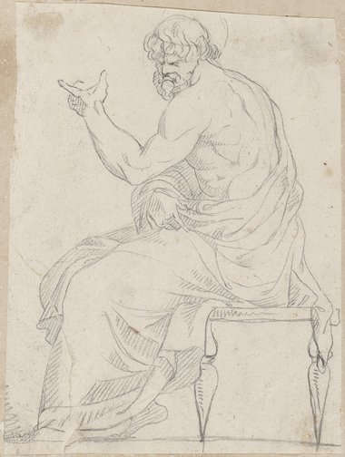 Auflichtaufnahme Seitenansicht einer sitzenden männliche Figur mit Bart und Zeigegestus